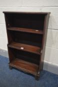 A 19TH CENTURY STAINED PINE WATERFALL OPEN BOOKCASE, on bracket feet, width 48cm x depth 21cm x