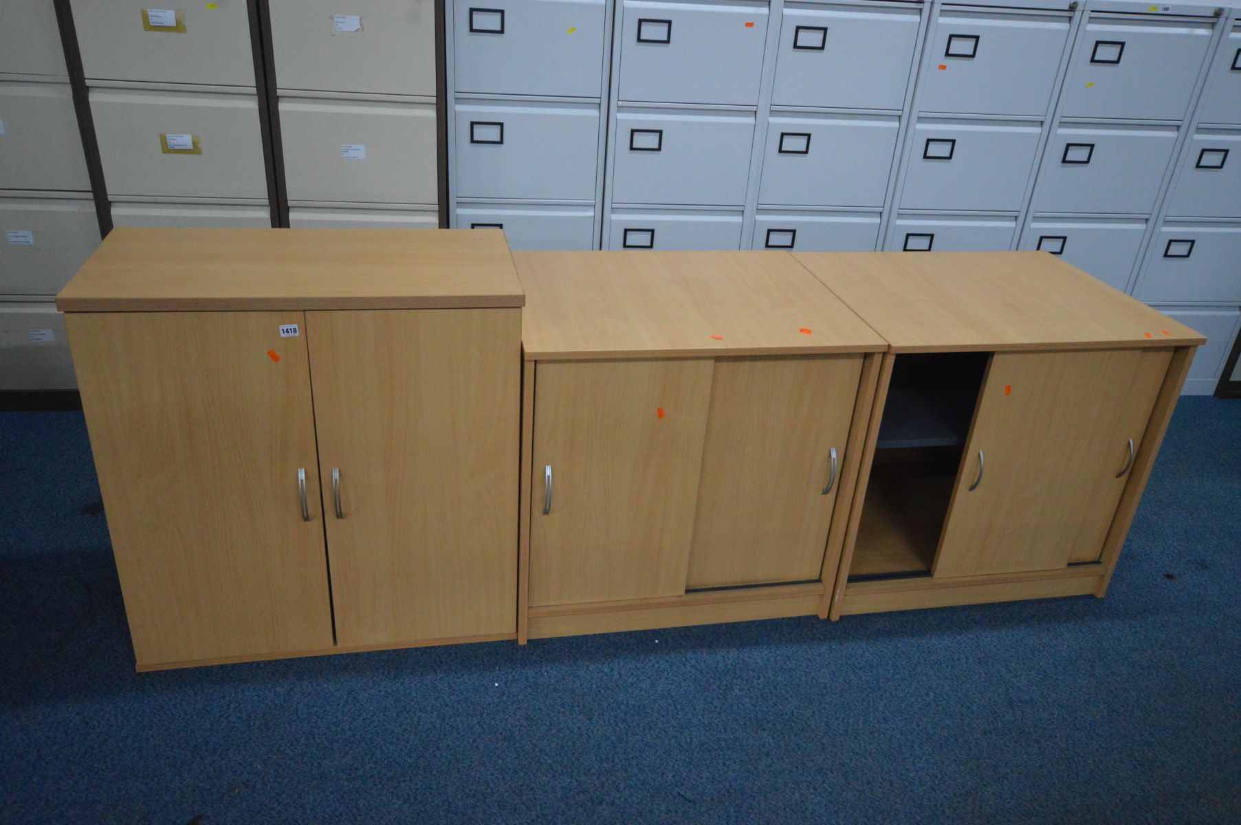 TWO BEECH SLIDING DOOR OFFICE CABINETS, width 75cm x depth 60cm x height 73cm, along with a