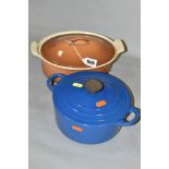 TWO LE CREUSET CAST IRON CASSEROLE DISHES WITH LIDS, comprising an oval 22cm example in good
