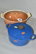 TWO LE CREUSET CAST IRON CASSEROLE DISHES WITH LIDS, comprising an oval 22cm example in good