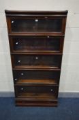 A GLOBE WERNICKE FIVE SECTION MAHOGANY BOOKCASE, glazed fall front doors, on a base with a single