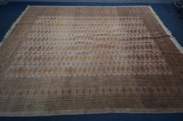 A WOOLLEN RUSSET TEKKE CARPET SQUARE, with a multi strap border, 368cm x 284cm (partially