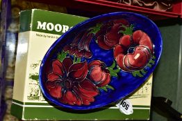 A MOORCROFT POTTERY OVAL BOWL, Anemone pattern on blue ground, impressed backstamp and painted
