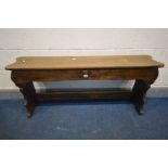 AN EARLY 20TH CENTURY BEECH BENCH, with a hinged top storage compartment, length 135cm