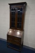 A TALL EARLY 20TH CENTURY OAK BUREAU BOOKCASE, width 78cm x depth 43cm x height 218cm