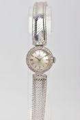 A LADY'S OMEGA 18CT GOLD AND DIAMOND WRISTWATCH, a round case measuring approximately 18mm in