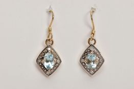 A PAIR OF YELLOW METAL, AQUAMARINE AND DIAMOND EARRINGS, each of a kite form, set with a central