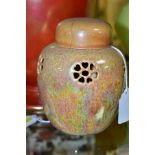 RUSKIN POTTERY, a large orange lustre pot pourri jar with cover, the jar has a ringed foot,