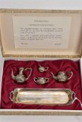 A BOXED MINIATURE SILVER FOUR PIECE TEA SET AND TRAY, each of baluster form, comprising a