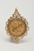 A GEORGE V 1914 HALF SOVEREIGN PENDANT, the half sovereign within a scrolling 9ct gold pendant