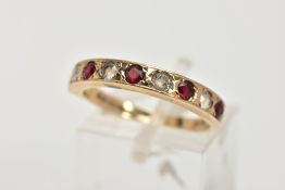 A 9CT GOLD GARNET AND SPINEL HALF ETERNITY RING, designed with a row of circular cut garnets