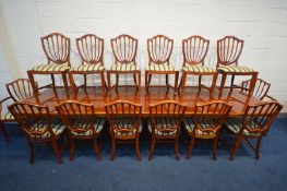 A LARGE IMPRESSIVE YEW WOOD AND CROSSBANDED TRIPLE PEDESTAL DINING TABLE, with two additional