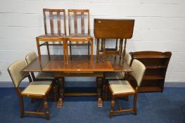 AN OAK DRAW LEAF TABLE together with a set of four chairs and two other chairs together with a small