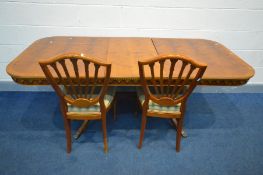 A YEWWOOD EXTENDING DINING TABLE, with a single fold out leaf, extended length 198cm x closed length
