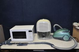 AN ELECTROLUX THE BOSS 3115 VACUUM CLEANER, a De'Longhi Dehumidifier and a Panasonic Microwave (