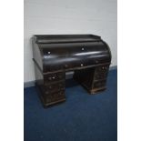 A VICTORIAN OAK CYLINDER PEDESTAL DESK, the top with a shaped raised gallery, the roll top with