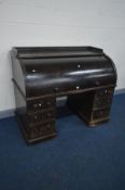 A VICTORIAN OAK CYLINDER PEDESTAL DESK, the top with a shaped raised gallery, the roll top with