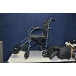 A DRIVE MOBILITY TRAVELITE FOLDING WHEELCHAIR with foot rests and carry bag