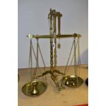 A DOYLE AND SON BRASS BEAM SCALE WITH SEVEN WEIGHTS, marked on beam and lever 'Doyle and Son,