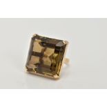 A 9CT GOLD, LARGE SMOKEY QUARTZ DRESS RING, designed with a four claw set, large square cut Smokey