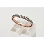 A YELLOW METAL FULL ETERNITY RING, set with colourless stones assessed as cubic zirconia, stamped '