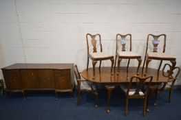 A WALNUT OVAL EXTENDING DINING TABLE, with an additional leaf, open length 212cm x closed length