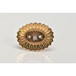A LATE VICTORIAN GOLD DIAMOND AND SPLIT PEARL BROOCH, the central raised oval panel set with an