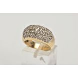 A 9CT GOLD DIAMOND ENCRUSTED CLUSTER RING, wide band with the ring head encrusted with round