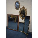 A QUANTITY OF MIRRORS comprising a brass rectangular cheval mirror, lion finials to the Corinthian