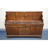 A GEORGIAN AND LATER MAHOGANY DESK, the top section with eight drawers and pull out writing slide,