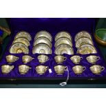 AN EARLY 20TH CENTURY/MEIJI PERIOD CASED SET OF TWELVE JAPANESE SATSUMA POTTERY COFFEE CUPS AND
