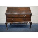 A GEORGIAN OAK AND STRUNG INLAID BUREAU, the fall front with a fitted interior above two short and