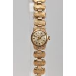 A 9CT GOLD LADY'S SANFORD BRO'S WRISTWATCH, the circular face with baton hour markers, the strap