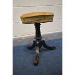 A LATE VICTORIAN EBONISED SWIVEL PIANO STOOL