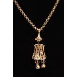 A 9CT GOLD, GEM SET CLOWN PENDANT AND CHAIN, the articulated clown pendant set with red and
