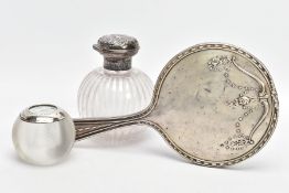 A SILVER VANITY MIRROR, SILVER LIDDED GLASS JAR AND A SILVER MOUNTED GLASS MATCHSTICK TIDY, the