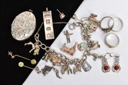 A SELECTION OF SILVER AND WHITE METAL JEWELLERY, to include an oval locket, a charm bracelet