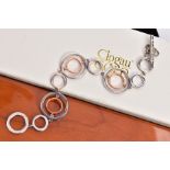 A CLOGAU SILVER AND GOLD BRACELET, openwork rose gold and silver circular links, fitted with a