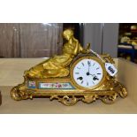 A FRENCH MIROY FRERES GILT METAL MANTEL CLOCK, a female beauty in classical dress holds a mirror,