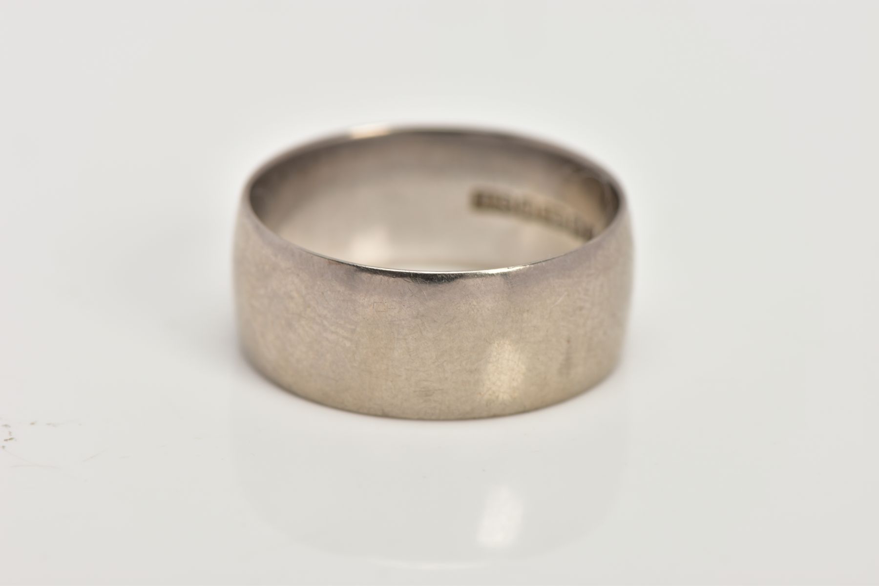 AN 18CT WHITE GOLD WIDE WEDDING BAND, of a plain polished design, approximate width 2.4mm,