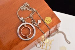 A CLOGAU PENDANT NECKLACE, the pendant of an openwork circular design, fitted with a tapered bail