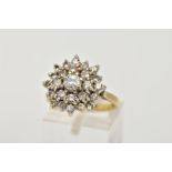 AN 18CT GOLD DIAMOND CLUSTER RING, large raised cluster set with round brilliant cut diamonds, total