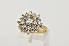 AN 18CT GOLD DIAMOND CLUSTER RING, large raised cluster set with round brilliant cut diamonds, total