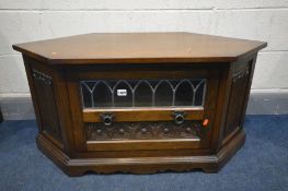 AN OLD CHARM OAK CORNER TV STAND, width 104cm x depth 49cm x height 51cm