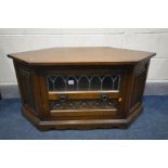 AN OLD CHARM OAK CORNER TV STAND, width 104cm x depth 49cm x height 51cm