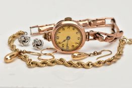 FIVE ITEMS OF JEWELLERY, to include a 1920's gold wrist watch, with black Arabic numerals and