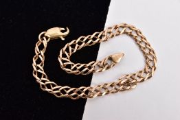 A YELLOW METAL DOUBLE CURB LINK BRACELET, double curb links, fitted with an AF lobster claw clasp,