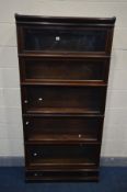 A GLOBE WERNICKE FIVE SECTION MAHOGANY BOOKCASE, glazed fall front doors, on a base with a single