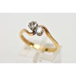 A MID TO LATE 20TH CENTURY TWO STONE CROSSOVER DIAMOND RING. Two early round brilliant cut