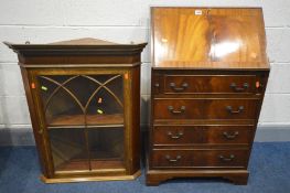 A REPRODUCTION MAHOGANY BUREAU, fall front enclosing a fitted interior above four drawers, width